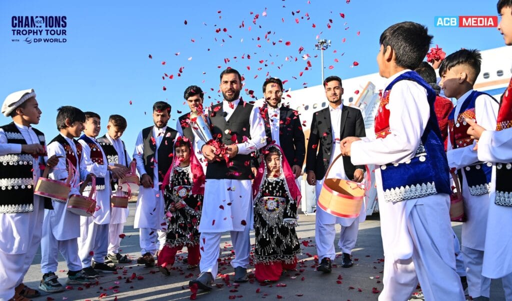 ICC Defends Afghanistan Cricket Board, Distances Sports from Government Policies Children dressed in traditional Afghan attire scatter rose petals to celebrate the ICC Champions Trophy during its December 2024 countrywide tour.