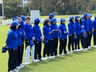 Afghan women's cricket team lined up on the field before their match in Melbourne, Australia.