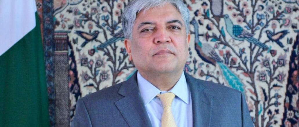 Shafqat Ali Khan, the newly appointed spokesperson for Pakistan’s Foreign Ministry Shafqat Ali Khan, dressed in a suit and tie, standing in front of a patterned background, representing his role as the spokesperson for Pakistan’s Foreign Ministry.