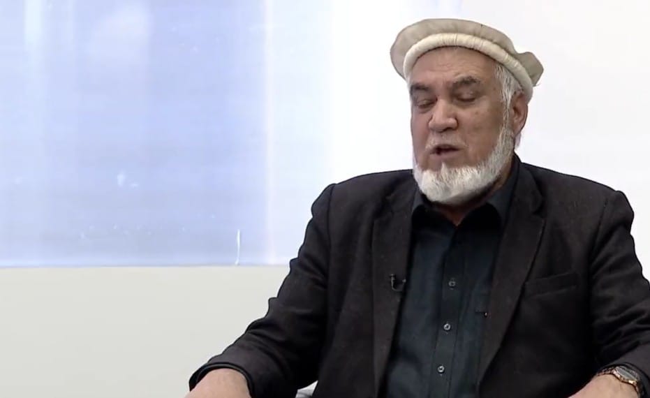 Pakistan Eases Afghan Trade Restrictions via Gwadar Port: A Boost or a Limited Move? Khan Jan Alokozay, a senior Afghan trade official wearing traditional attire, speaks during an interview, highlighting issues related to Afghan trade and regional cooperation.