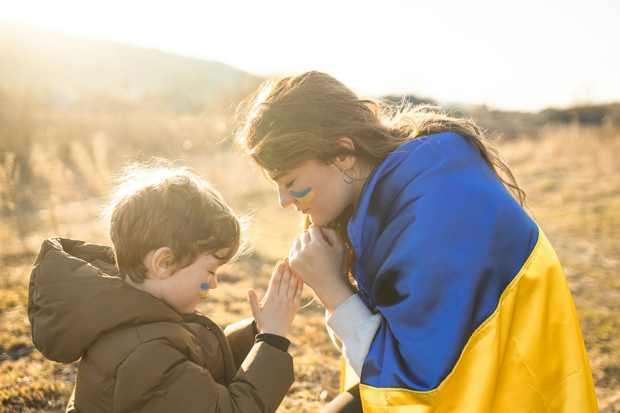 Ukrainian mother with her son. Patriots of Ukraine. Refugees from Ukraine. Pray for Ukraine.